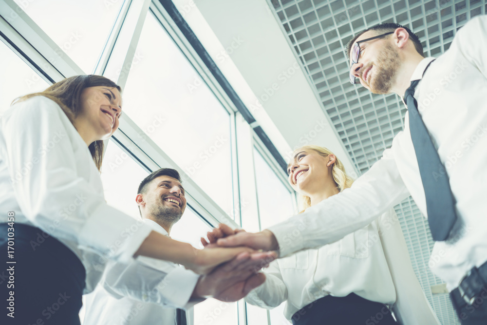 Obraz premium The business people hold hands together