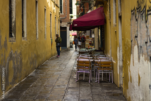 Street cafe in a narrow street © Alex