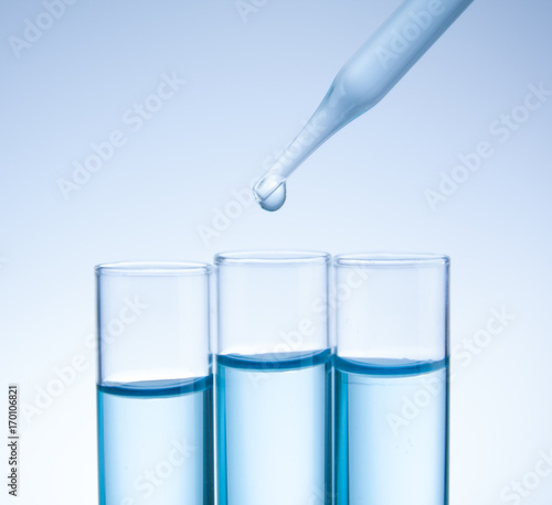 Substance over laboratory test tubes