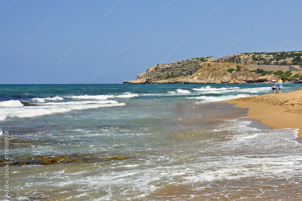 Beautiful clean sea and waves. Summer background for travel and holidays. Greece Crete.. Amazing scenery on the beach.