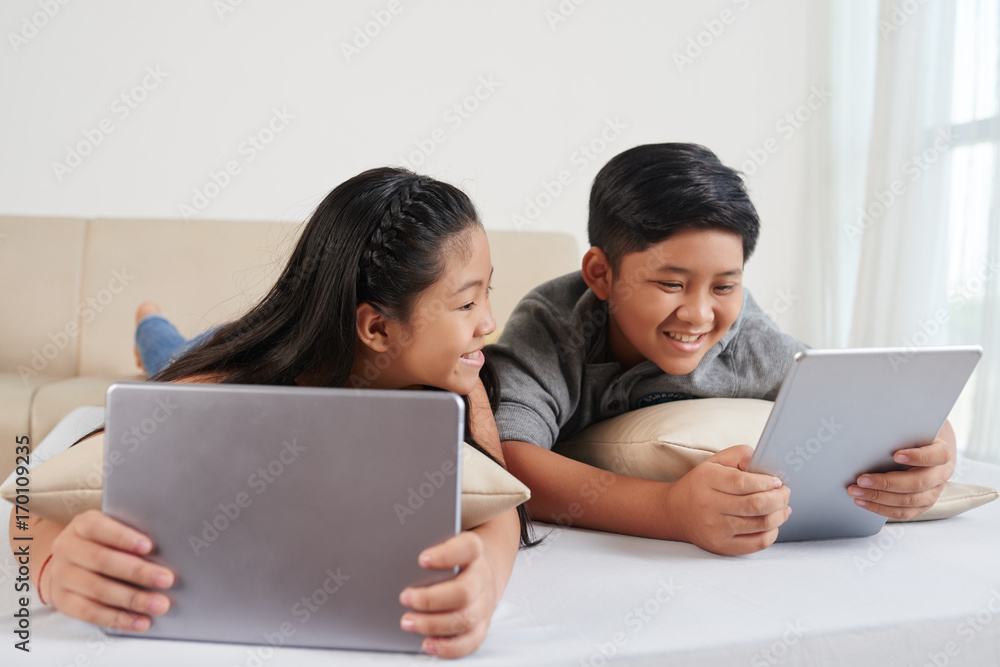 Children with digital tablets Children with digital tablets