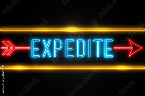 Expedite  - fluorescent Neon Sign on brickwall Front view photo