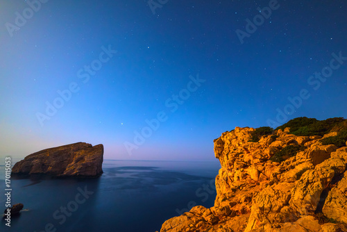 Foradada island under a clear sky at night