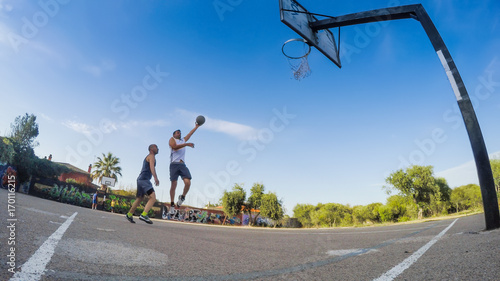 Sky hook shot in a basketball playground
