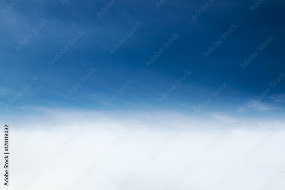 Blurred nature background of minimal blue cyan sky with soft clouds under wind movement in vintage style