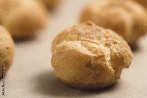 profiteroles on brown paper closeup