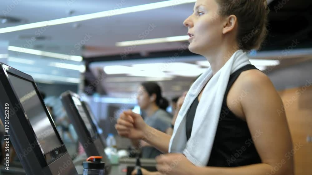 Young Woman Exercising on Treadmill In Fitness Sport Club. 4K. Young Woman Exercising on Treadmill In Fitness Sport Club. 4K.