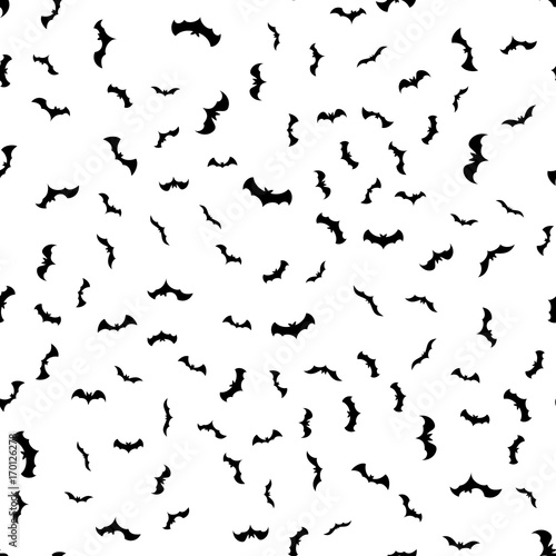 Seamless pattern with black bats of different shapes on a white background. Design for a happy Halloween. Vector illustration.