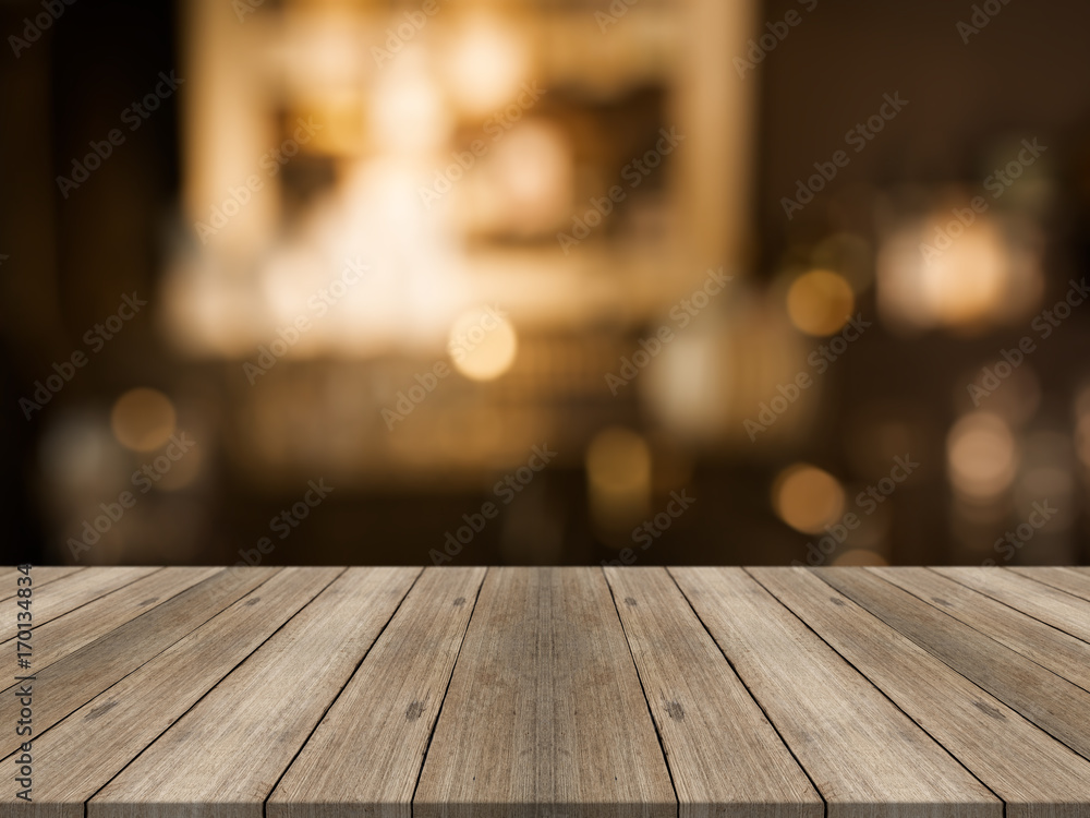 Empty wood table top on blurred background,for montage your products