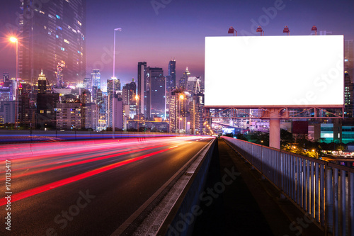 light trail night street with blank white billboard