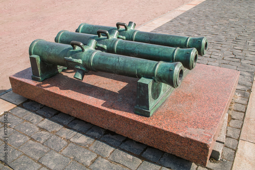 Three old bronze cannons