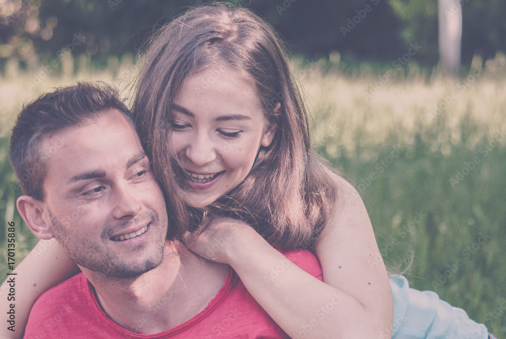 young couple in love and tenderness hugging in park. young couple in love and tenderness hugging in park.