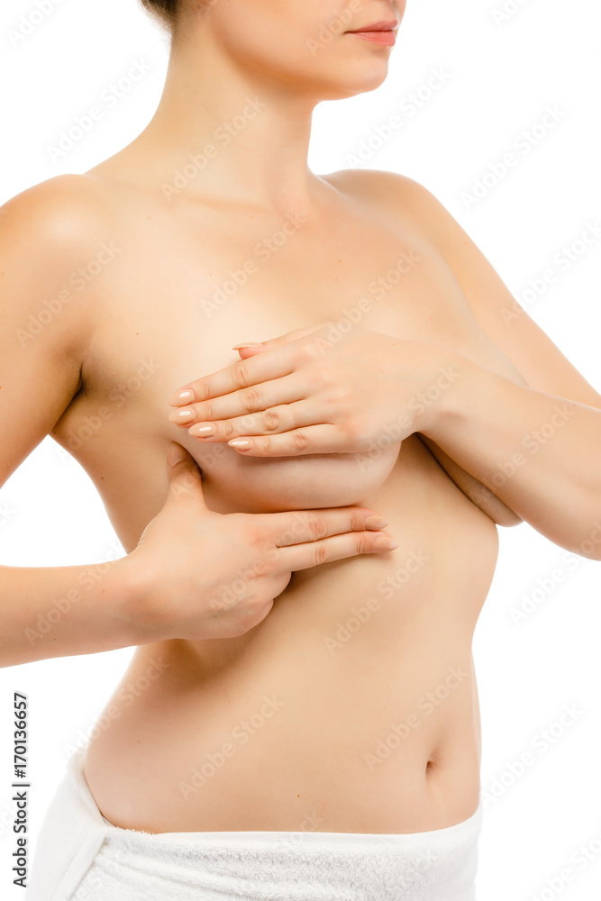 Woman examining her breast isolated on white background Woman examining her breast isolated on white background
