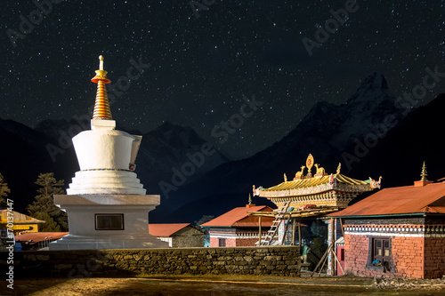 Buddhist stupa of Tengboche Monastery and the top of Everest in the background with millions stars at night, Tengboche Monastery, Everest Base Camp Trek, Sagarmatha National Park, Nepal.