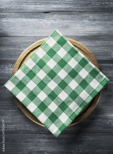 napkin and board on wooden background