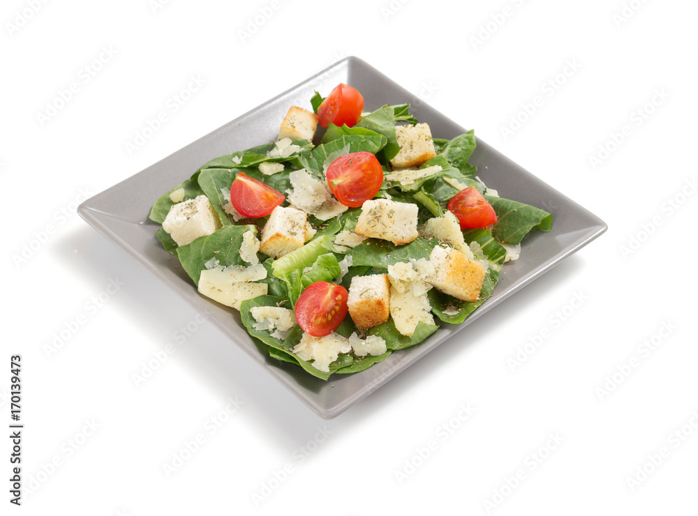 caesar salad in plate on white background caesar salad in plate on white background
