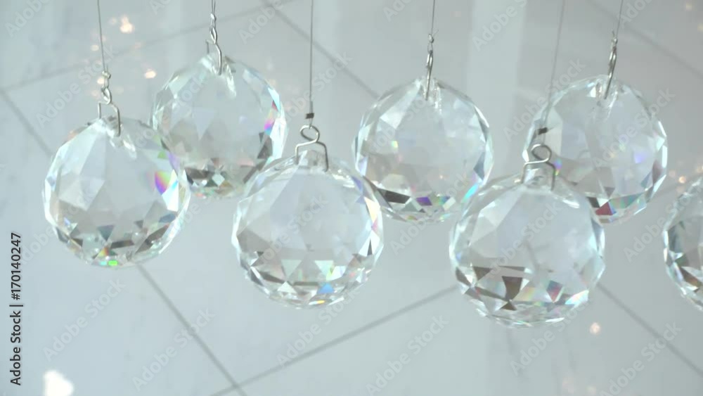 4K Crystals closeup. Crystal modern chandelier detail background. Hanging diamonds with blinking shining reflection. High speed camera shot interior 4K Crystals closeup. Crystal modern chandelier detail background. Hanging diamonds with blinking shining reflection. High speed camera shot interior