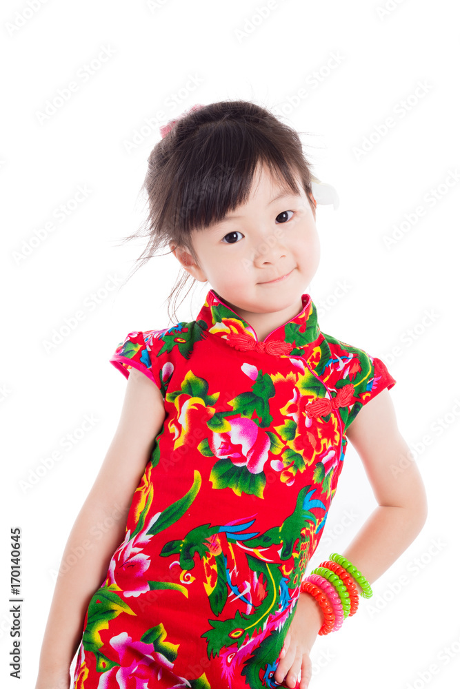 Little asian girl wearing red chinese traditional dress standing over white background Little asian girl wearing red chinese traditional dress standing over white background