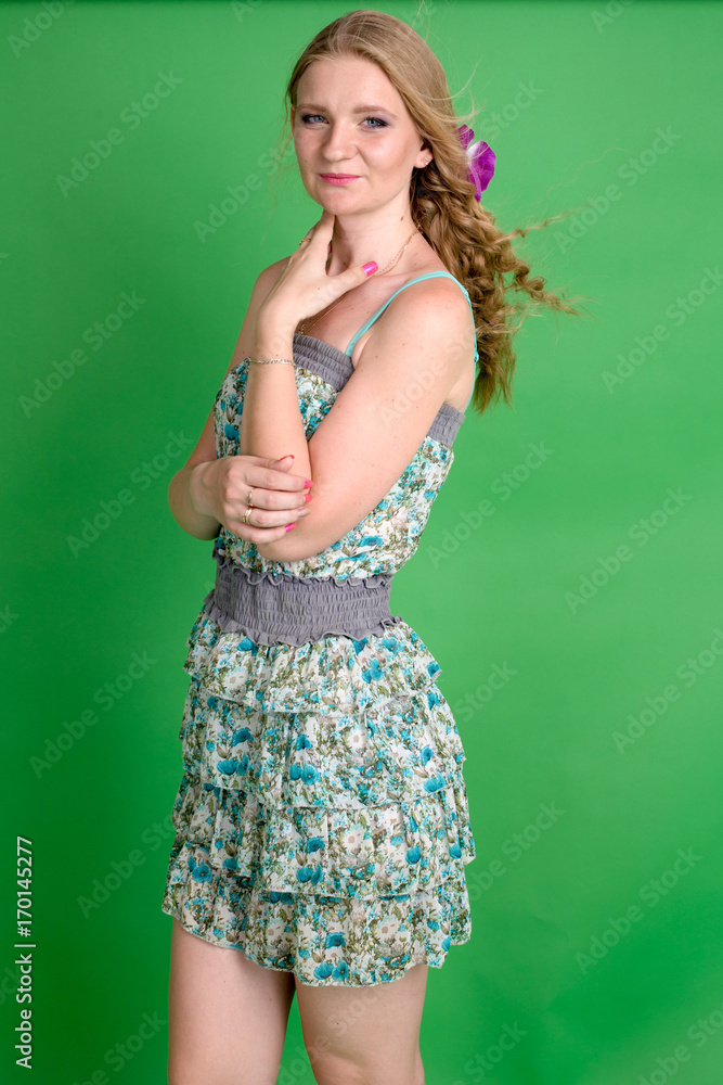 Beautiful romantic girl blonde in summer dress with orchid flower
Beautiful romantic girl blonde in summer dress with orchid flower