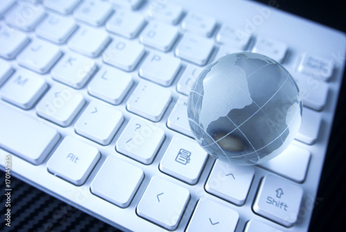 glass globe on the white keyboard