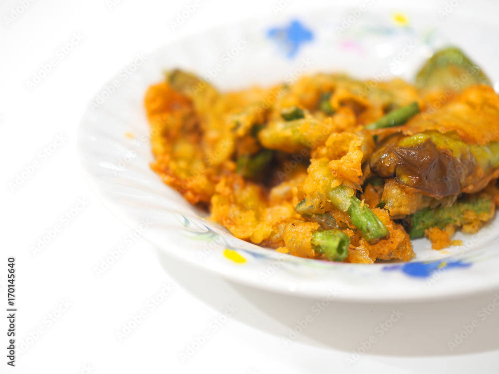 Perspective string bean, eggplant deep fried tempura on white ceramic plate, white background