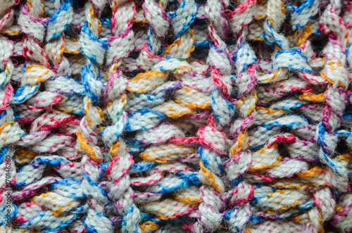 Multi-colored knitted fabric cozy texture background close-up © v_sot