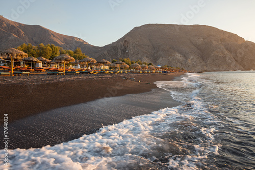Perissa beach during sunrise on the Greek island of Santorini.