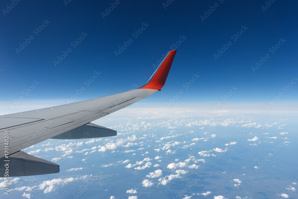 the wing of the plane in the sky the wing of the plane in the sky