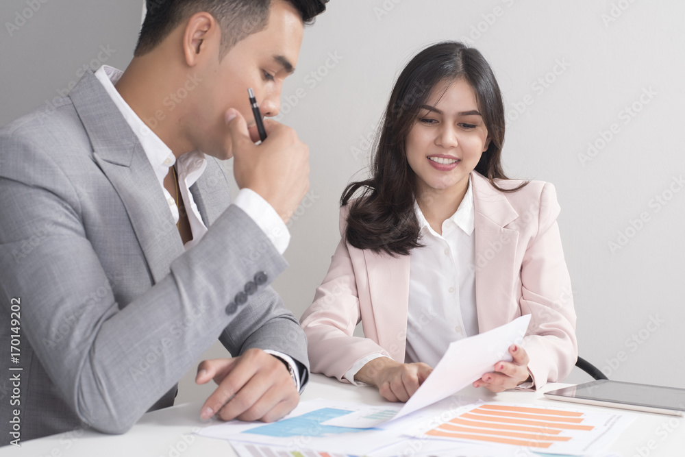 Businessman and businesswoman are analytic graph ,Business plan and business meeting concept Businessman and businesswoman are analytic graph ,Business plan and business meeting concept