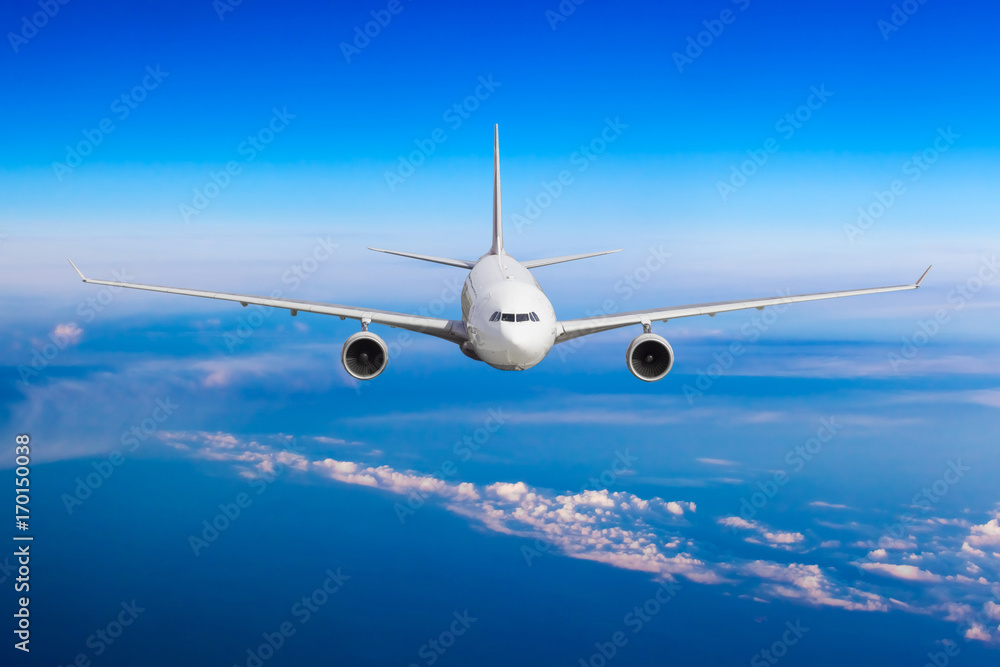Naklejka premium aeroplane flying above clouds. Passenger Airliner flying