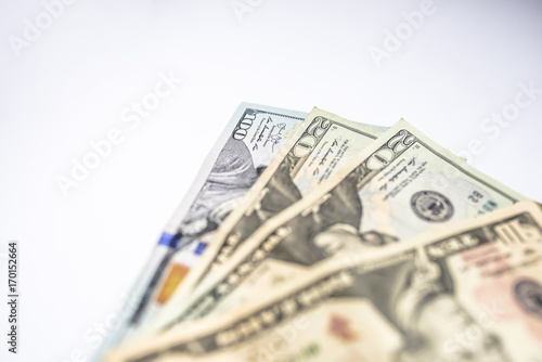 many dollars on a white background isolated