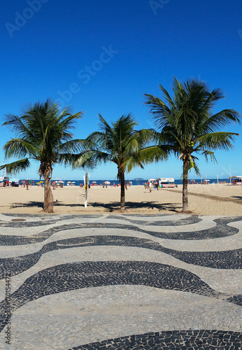 Copacabana and the famous geometric boardwalk and coconut trees on the beach