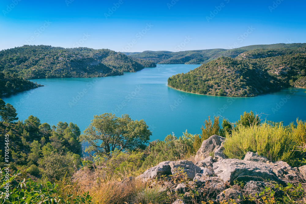 Fototapeta premium Lake Esparron (lac Esparron de Verdon), one of the five lakes of the Verdon Gorge National Park. Beautiful daytime landscape, popular tourist destination in Provence, Alpes-de-Haute-Provence, France