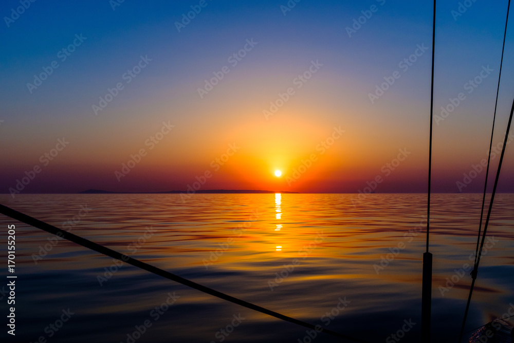 Sunrise from sailboat over the Aegean sea Sunrise from sailboat over the Aegean sea