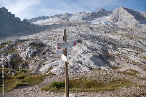 mountaineering in marmolada glacier in dolomites