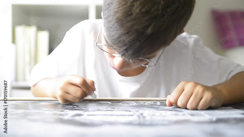 Little boyl writing to the copy blackboard Little boyl writing to the copy blackboard
