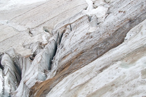 mountaineering in marmolada glacier in dolomites photo