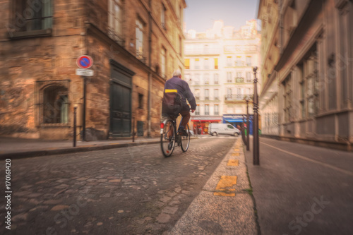 Wallpaper Mural Parisian postman on a bicycle on the rue Geoffroy l'Asnier Torontodigital.ca