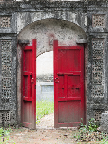 Old half opened red door © santiago silver