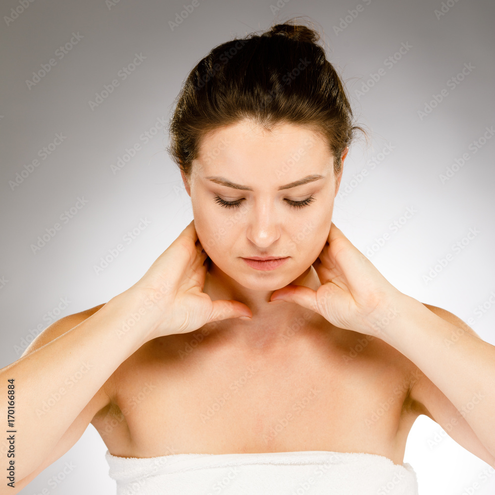 Woman massaging neck pain Woman massaging neck pain