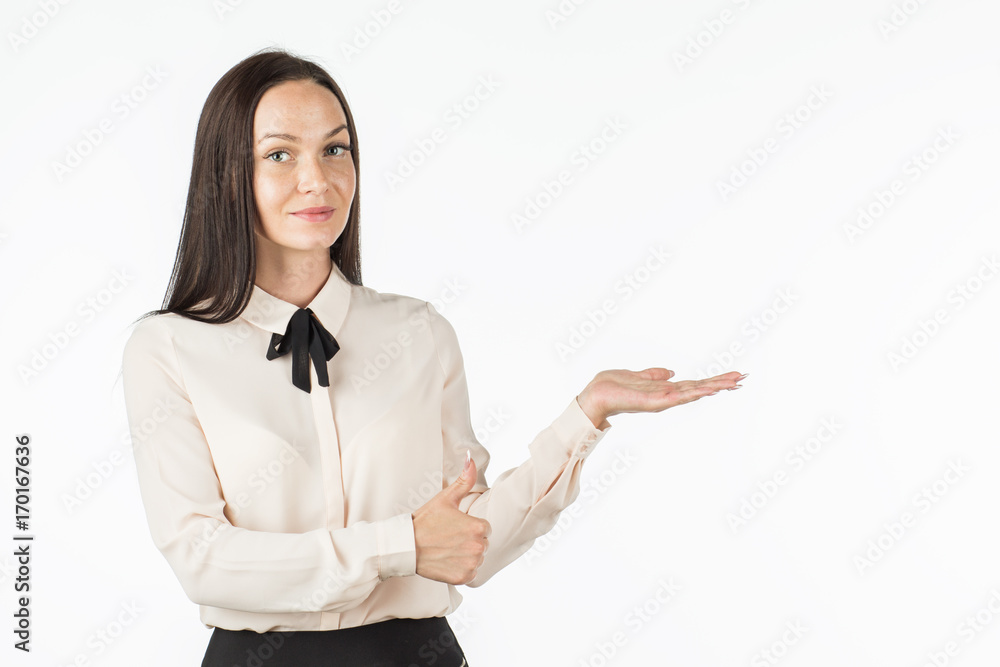 Young beautiful woman points to the object on the left / right. The girl smiles and points to the side. An attractive business lady is advertising something. Place for your text. Young beautiful woman points to the object on the left / right. The girl smiles and points to the side. An attractive business lady is advertising something. Place for your text.