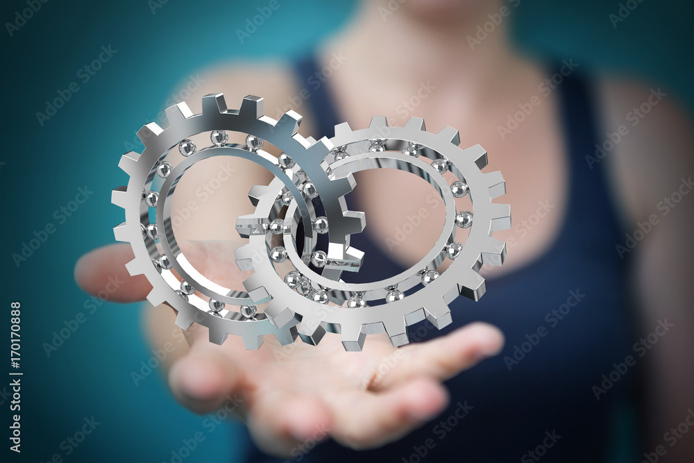 Businesswoman using floating modern gear mechanism 3D rendering Businesswoman using floating modern gear mechanism 3D rendering