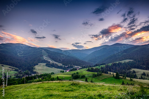 Background with Ukrainian Carpathian Mountains during the sunset in the Pylypets