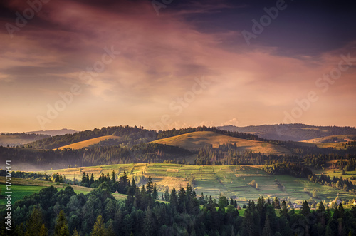 Background with Ukrainian Carpathian Mountains during the sunset in the Pylypets