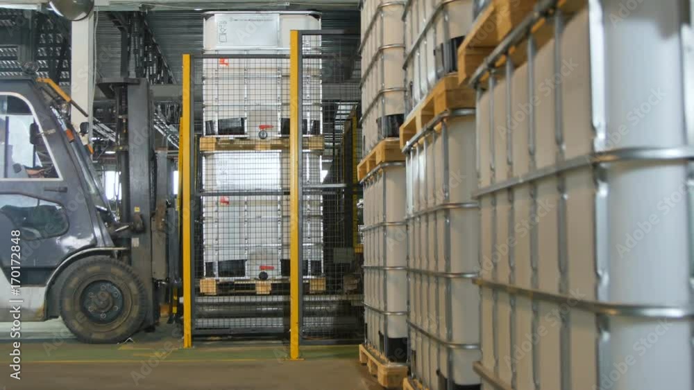 Side View Modern Powerful Forklift Takes and Transports Tanks Side View Modern Powerful Forklift Takes and Transports Tanks