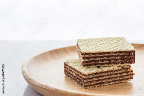 Closeup image, wafers on a wooden plate.