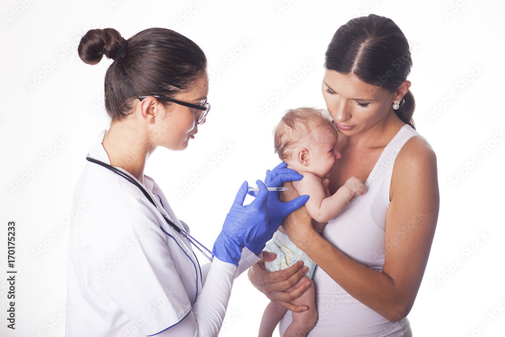 Young female doctor giving an injection. Young female doctor giving an injection.