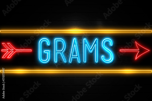 Grams - fluorescent Neon Sign on brickwall Front view