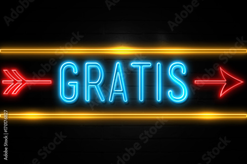 Gratis - fluorescent Neon Sign on brickwall Front view