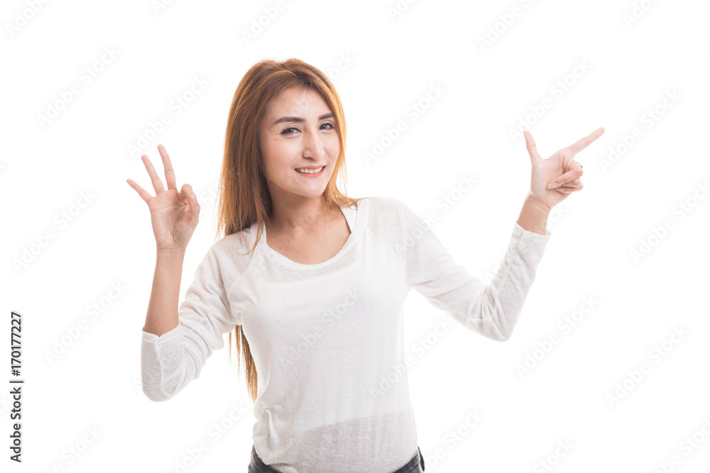 Young Asian woman point and show OK. Young Asian woman point and show OK.